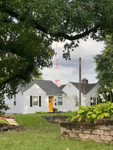 That vibrant yellow door brightens the whole scene!